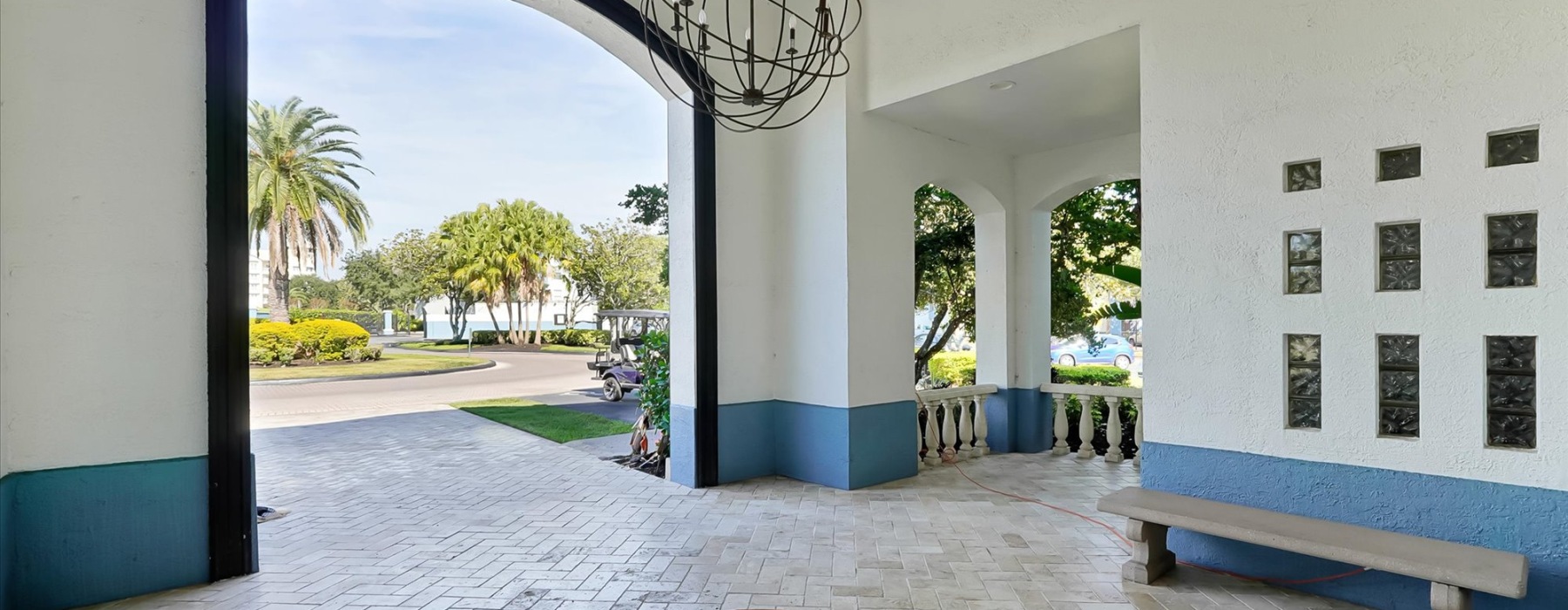 tiled entranceway with trees in the background